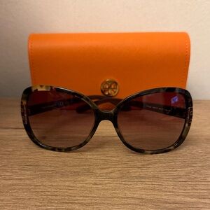 Tory Burch oversized sunglasses.